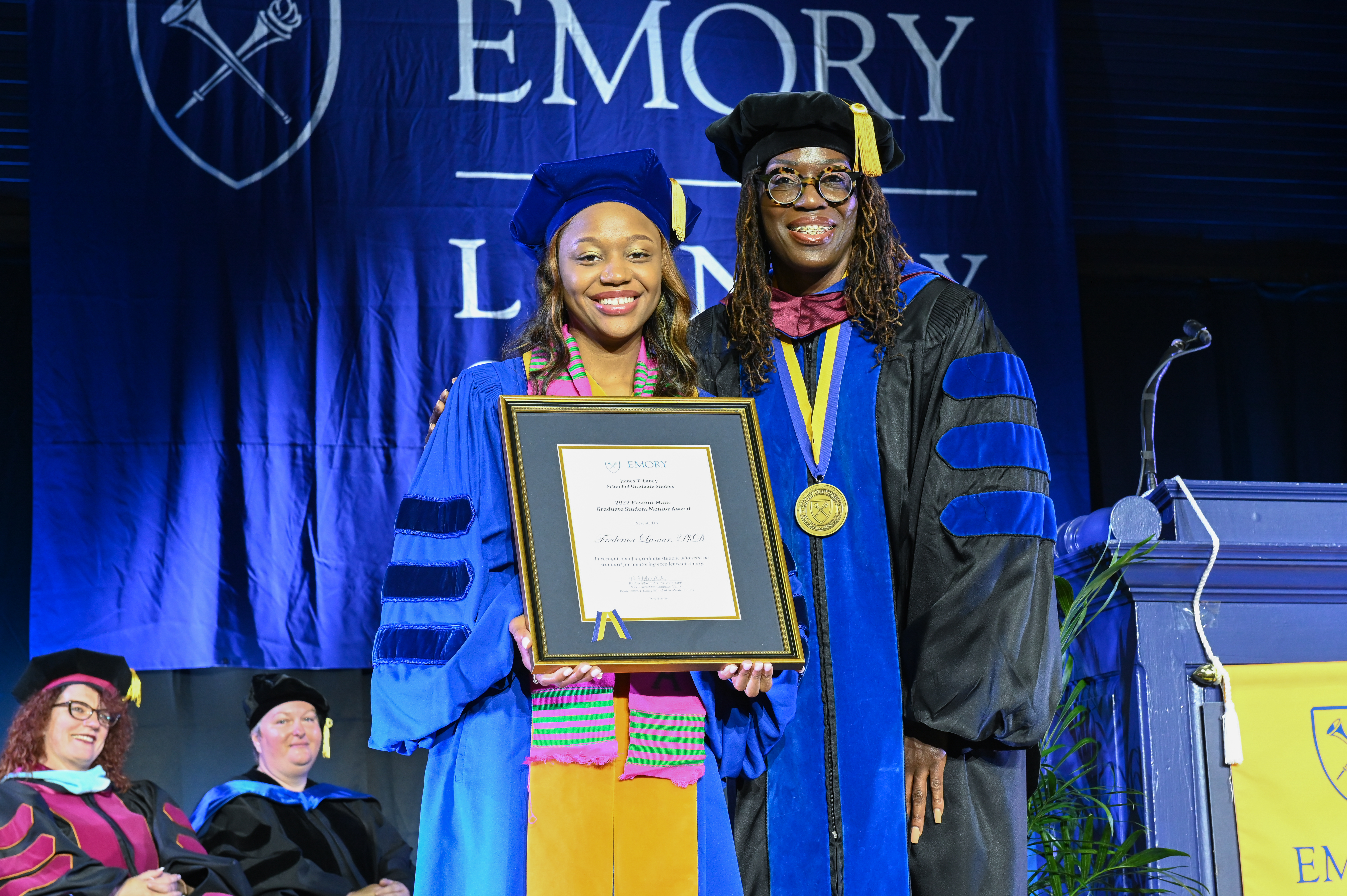 graduate receiving Eleanor Main Student Mentor Award